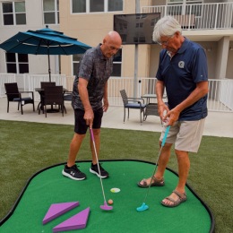 men playing put put