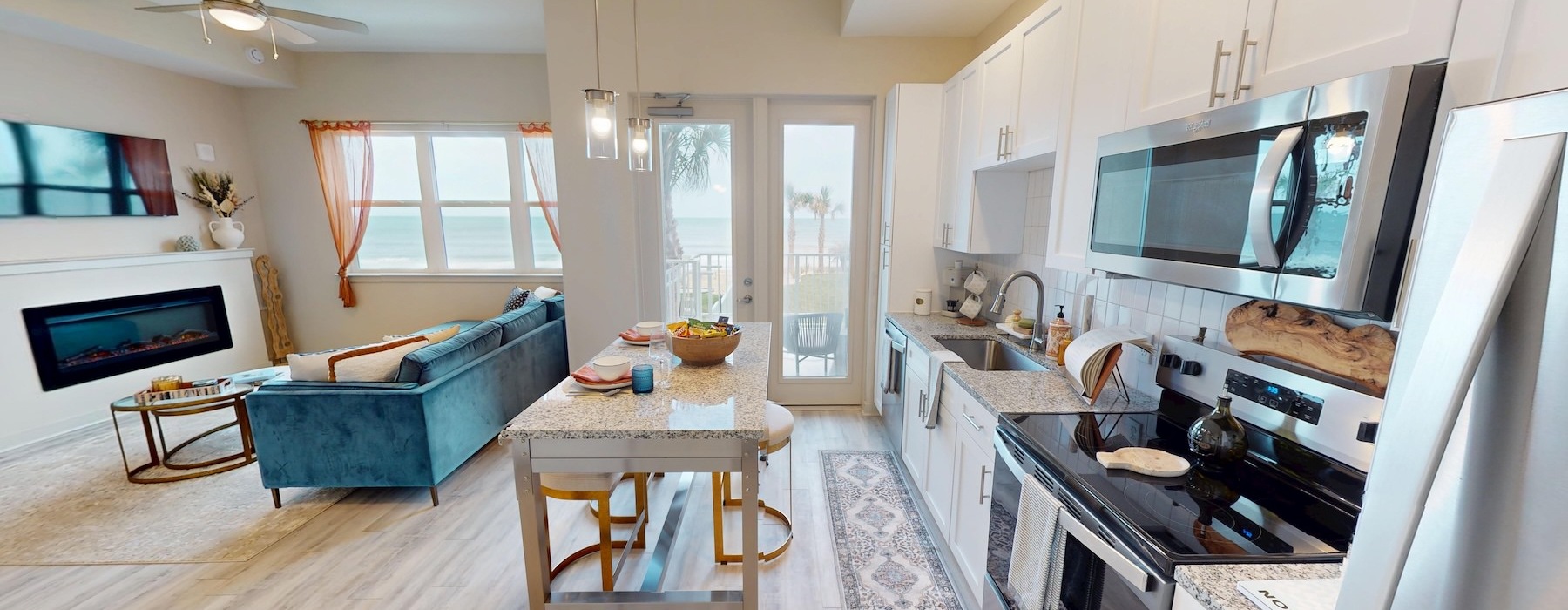 a kitchen with a table and a couch