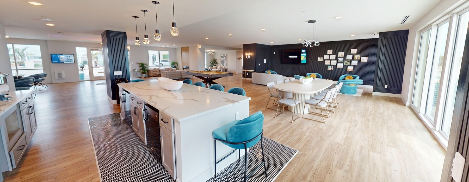 a clubroom with a community kitchen