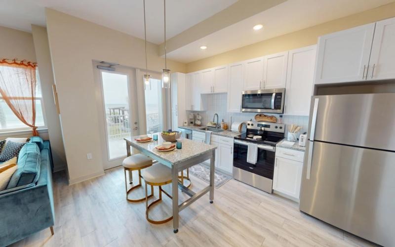 a kitchen with a table and chairs